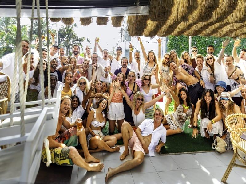 The whole camp gathered under the thatched terrace at The Surfer Beach Camp, Weligama, Sri Lanka