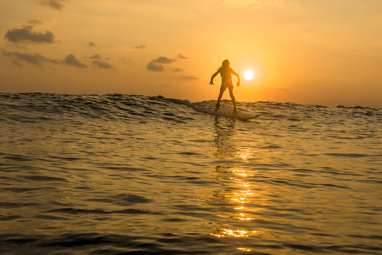 beautiful sunset surfing photo